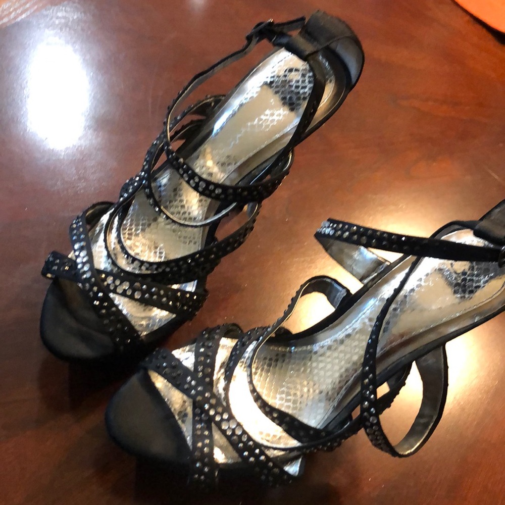 Black heels with rhinestone runs a little narrow.